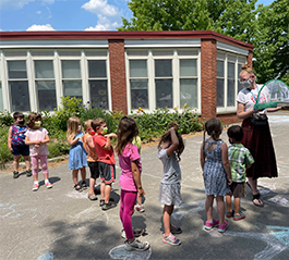 students in a line looking at butterflies